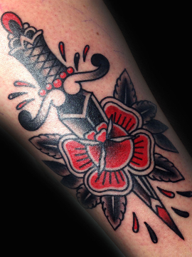 Traditional tattoo with dagger and rose motif