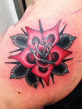 Rose tattoo on shoulder