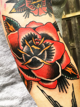 Traditional rose tatoo design in Amsterdam